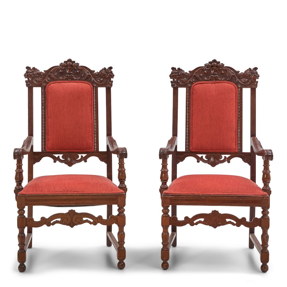 Pair of Baroque-Style American Carved Mahogany Armchairs,: Pair of Baroque-Style American Carved Mahogany Armchairs, each with a tall upholstered back surmounted by a shaped and molded crest rail, a padded seat, scrolling open arms supported by turned posts,
