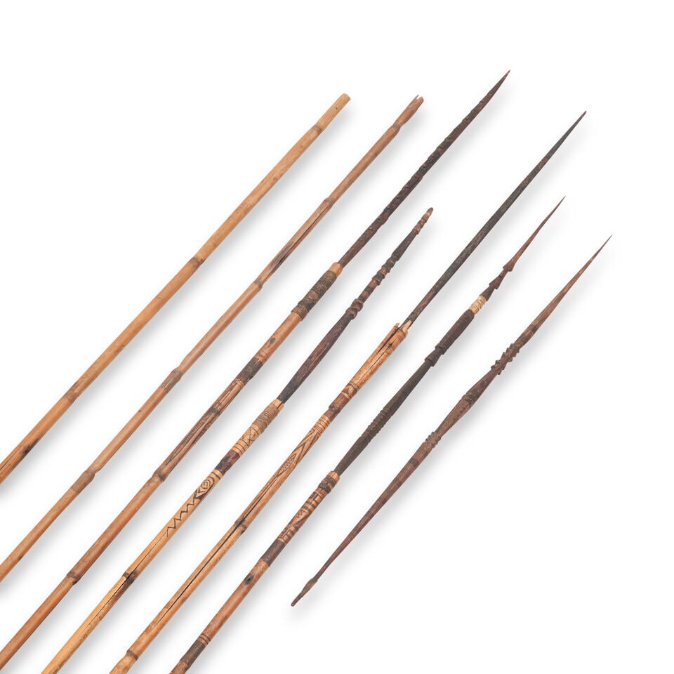 A Collection Of Bamboo And Wood Arrows, African or Oceania, 20th century,: A Collection Of Bamboo And Wood Arrows, African or Oceania, 20th century, Each with a long bamboo shaft decorated with incised linear and geometric designs, fitted with pointed wood tips, lg. to 65 1/
