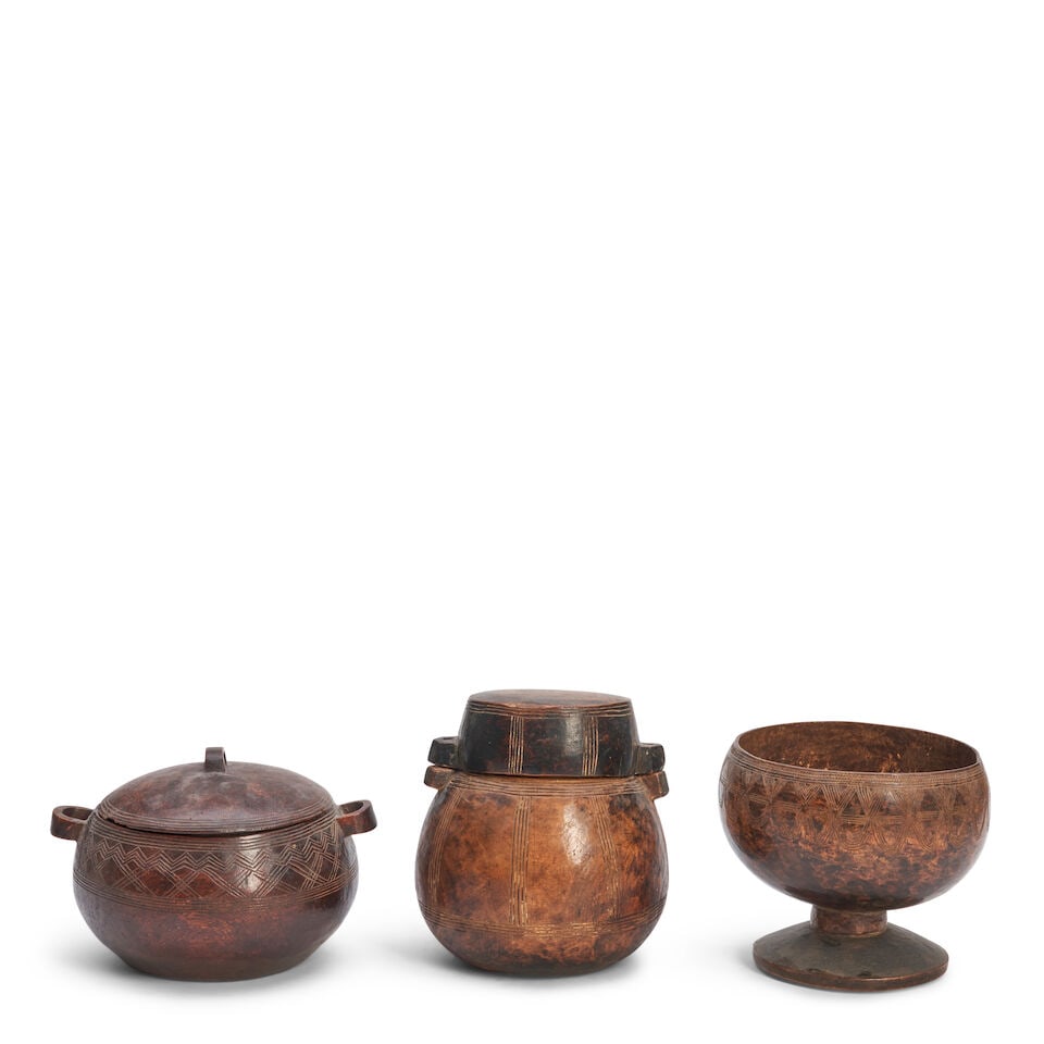 Three Nyanga Carved Wood Vessels,: Three Nyanga Carved Wood Vessels, including two with lids, ht. to 6 1/4 in. Lot to be sold without reserve. This lot is subject to the following lot symbols: ¤ ¤ Unless indicated by the 