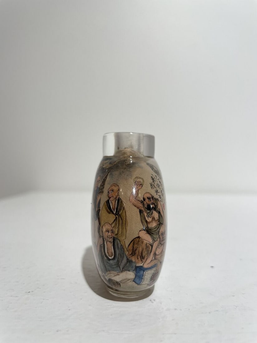AN INSIDE PAINTED GLASS 'EIGHTEEN LUOHAN' SNUFF BOTTLE Signed Liu Shouben (b.1943), 1979 - 6