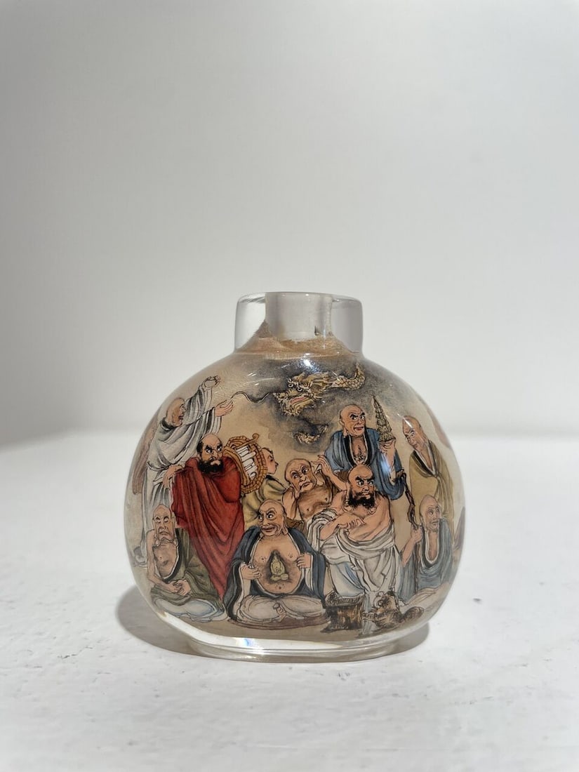 AN INSIDE PAINTED GLASS 'EIGHTEEN LUOHAN' SNUFF BOTTLE Signed Liu Shouben (b.1943), 1979 - 7
