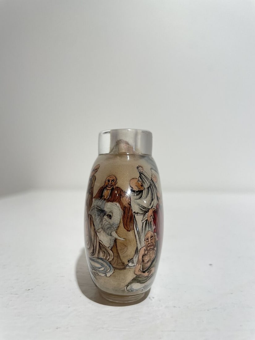 AN INSIDE PAINTED GLASS 'EIGHTEEN LUOHAN' SNUFF BOTTLE Signed Liu Shouben (b.1943), 1979 - 8