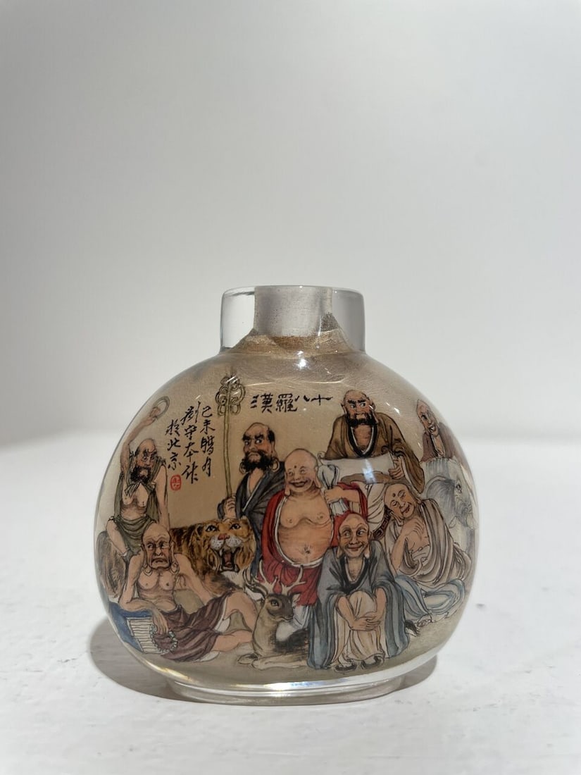 AN INSIDE PAINTED GLASS 'EIGHTEEN LUOHAN' SNUFF BOTTLE Signed Liu Shouben (b.1943), 1979 - 9