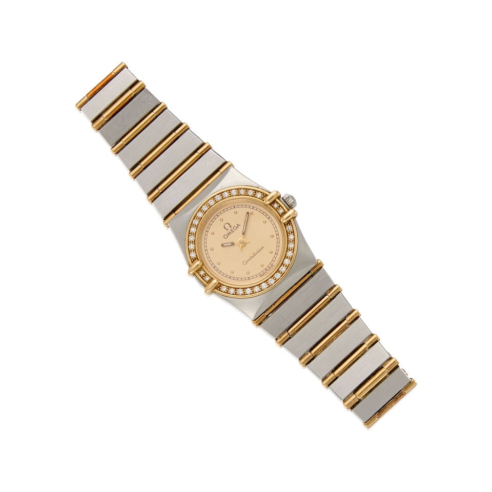 OMEGA: A STAINLESS STEEL AND GOLD CONSTELLATION WRISTWATCH: OMEGA: A STAINLESS STEEL AND GOLD CONSTELLATION WRISTWATCH • Stainless steel and low karat gold watch case and bracelet • Numerous round shaped melee diamonds • Signed OMEGA