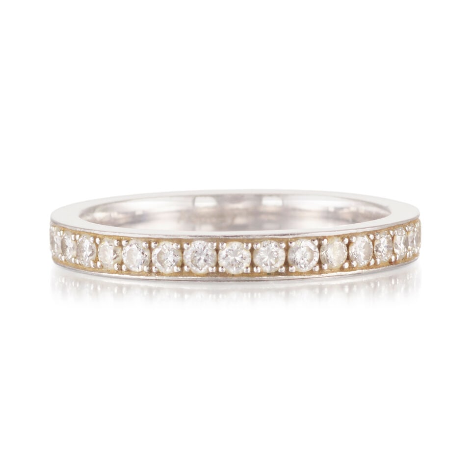 ASPREY: A PLATINUM AND DIAMOND BAND: ASPREY: A PLATINUM AND DIAMOND BAND • Numerous round shaped diamonds weighing approximately 0.33 carat total • Stamped ASPREY • Size 6 • Estimated gross weight: 3.8