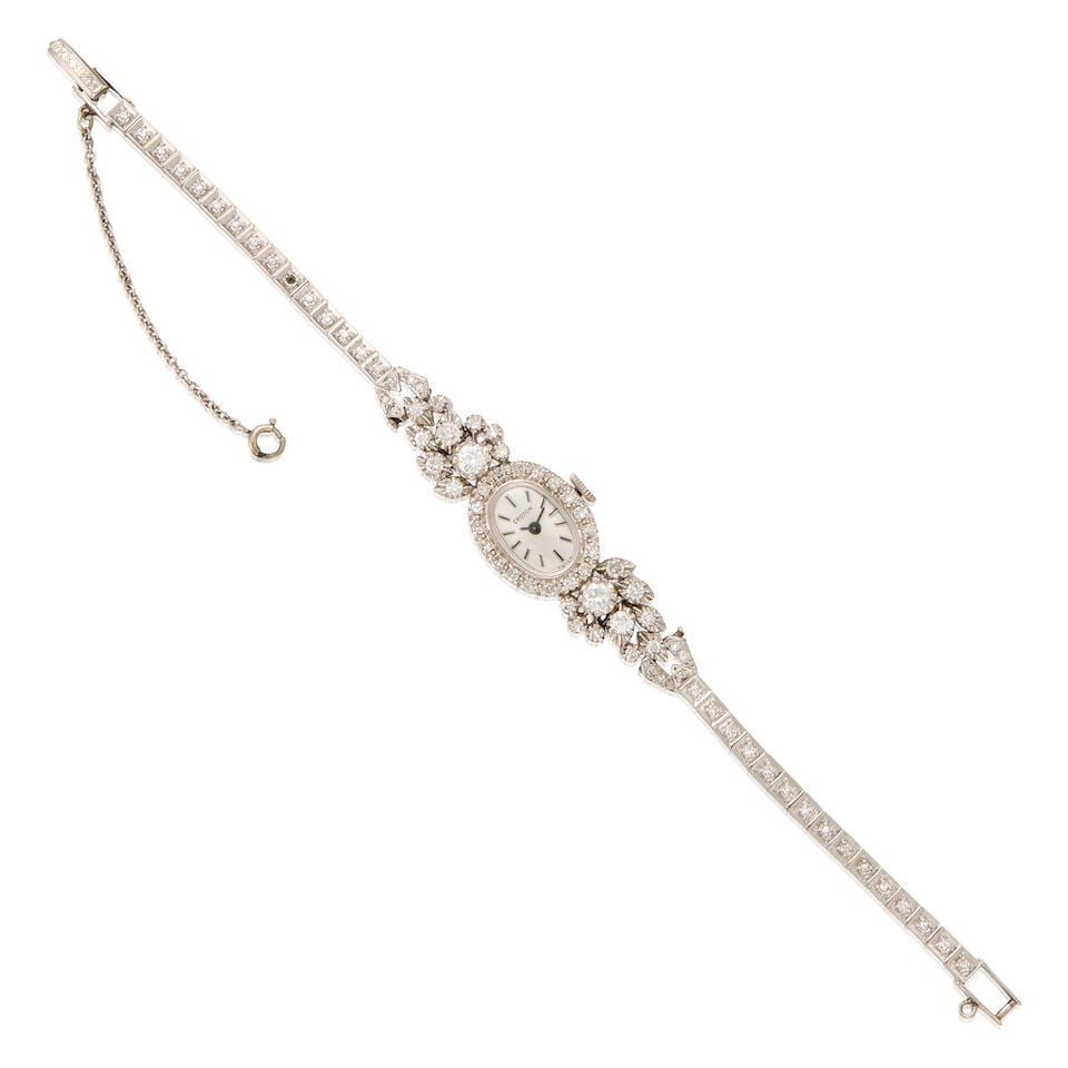 14K WHITE GOLD AND DIAMOND WRISTWATCH: 14K WHITE GOLD AND DIAMOND WRISTWATCH • 14K white gold watch case and bracelet • Numerous round shaped diamonds weighing approximately 1.50 carats total • Signed CROTON on the