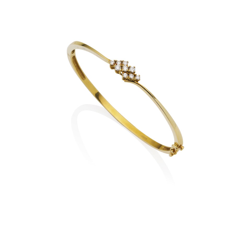 CERRONE | DIAMOND HINGED BANGLE: CERRONE | DIAMOND HINGED BANGLE - Set to the top with nine round brilliant-cut diamonds - Estimated total diamond weight 0.30 carats - Stamped Cerrone 750 - Weight 10.4gm, inner circumference