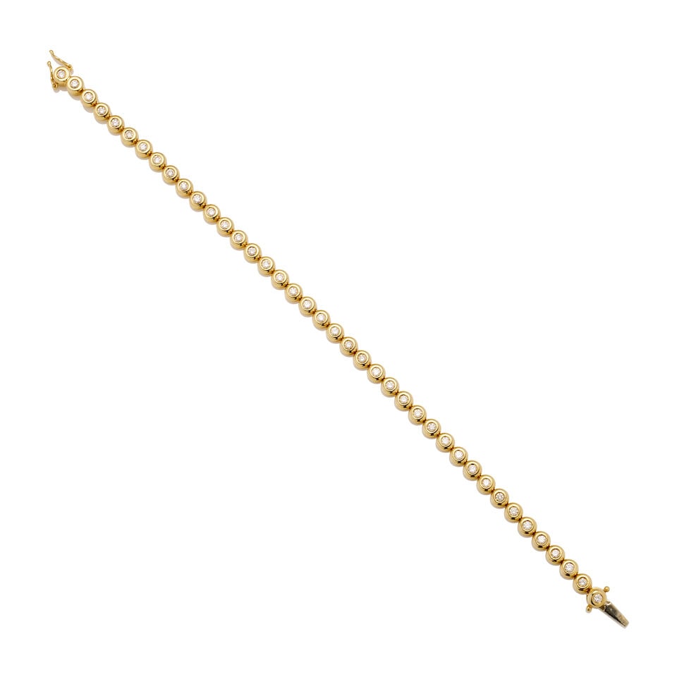 DIAMOND LINE BRACELET: DIAMOND LINE BRACELET • 40 bezel set round brilliant-cut diamonds • Stamped 750 • Weight 15.2gm, length 18.0cm. Footnotes: OVERALL CONDITION: Good Metal purity tested with XRF