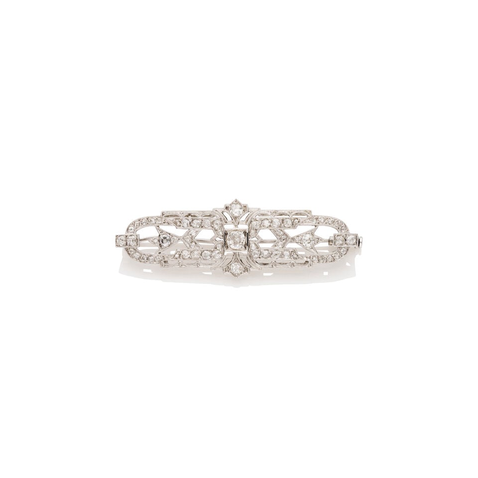 SMALL OPENWORK DIAMOND BROOCH: SMALL OPENWORK DIAMOND BROOCH - Milgrain edge and pavé-set old European-cut diamond brooch - Centre diamond weighing approximately 0.23ct - Accented by approximately 60 diamonds throughout the