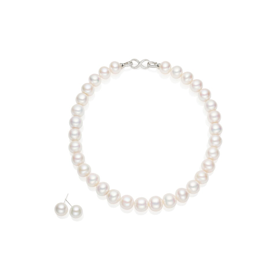 CULTURED PEARL NECKLACE AND EARRING SUITE: CULTURED PEARL NECKLACE AND EARRING SUITE 1. 32 near round freshwater cultured pearls measuring approximately 13.0 - 14.5mm; full length 44cm. - Round white accent crystals on the clasp - Metal clasp