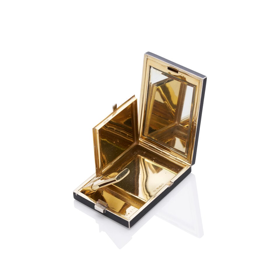 BOUCHERON | SILVER GILT LIPSTICK AND POWDER COMPACT: BOUCHERON | SILVER GILT LIPSTICK AND POWDER COMPACT - English import marks - Stamped 925 - With Boucheron fitted box - Approximate length 7cm x width 5cm x depth 1cm Footnotes: OVERALL