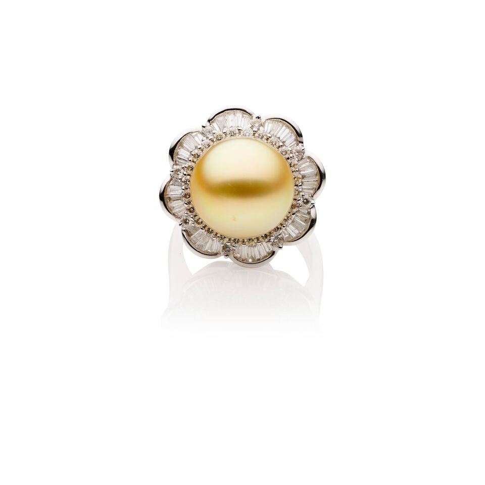 GOLDEN PEARL AND DIAMOND RING: GOLDEN PEARL AND DIAMOND RING - Floral design South Sea golden pearl and diamond ring - Pearl approximately 12mm round - Halo of round and tapered baguette cut diamonds - Stamped 750; estimated gross