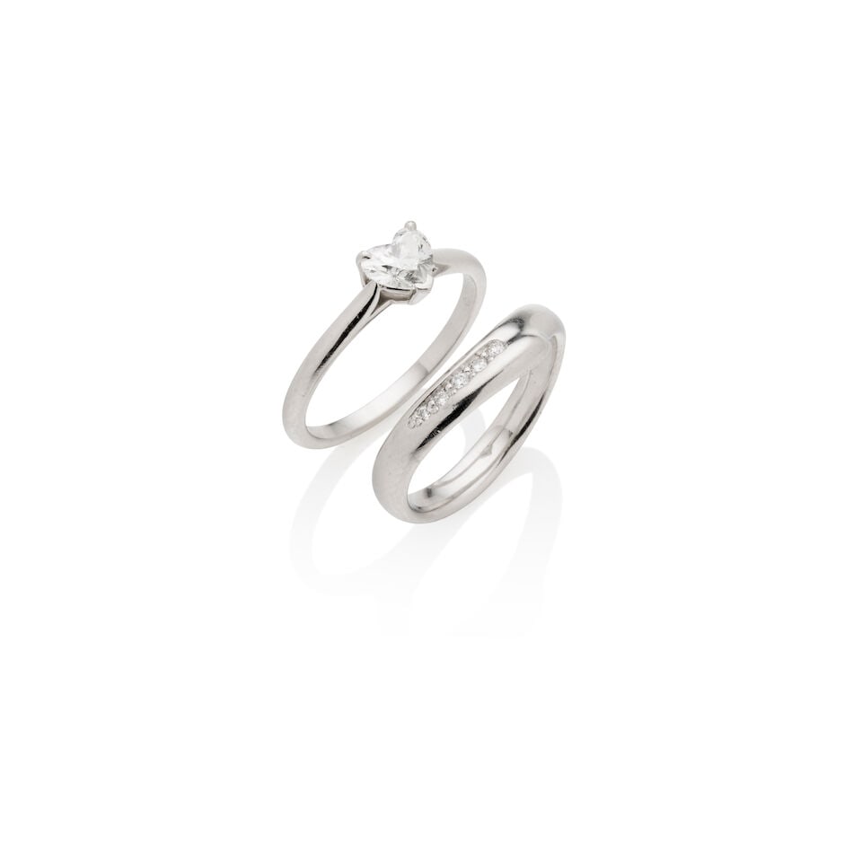 TIFFANY & CO. | TWO DIAMOND RINGS: TIFFANY & CO. | TWO DIAMOND RINGS 1. Tiffany & Co. heart shaped diamond ring, the heart-shaped diamond weighing 0.41carats, mounted in platinum, signed Tiffany & C0., numbered, accompanied by Tiffany 