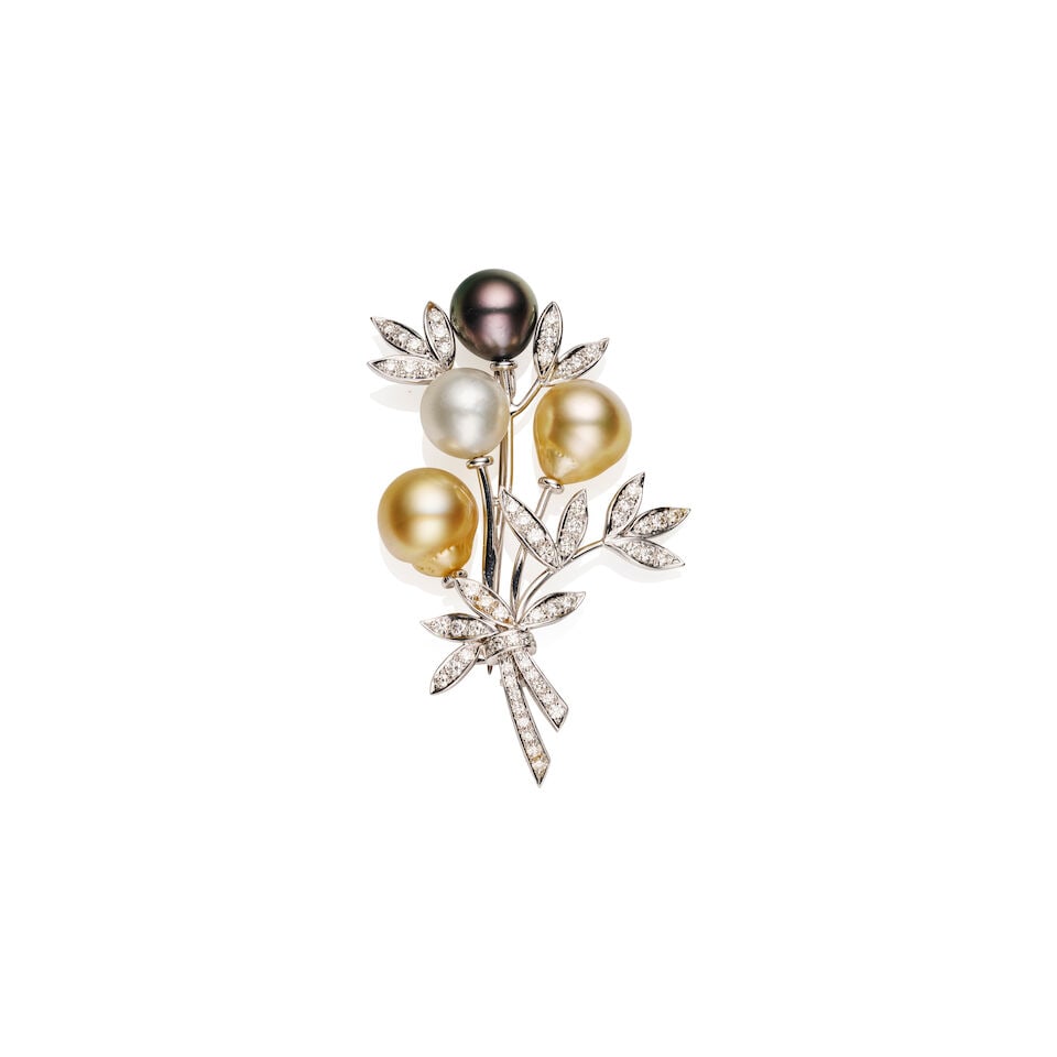 DIAMOND AND COLOURED CULTURED PEARL BROOCH: DIAMOND AND COLOURED CULTURED PEARL BROOCH Floral bouquet cultured pearl and diamond brooch featuring one South Sea white pearl, two drop-shape light golden pearls and one Tahitian pearl.