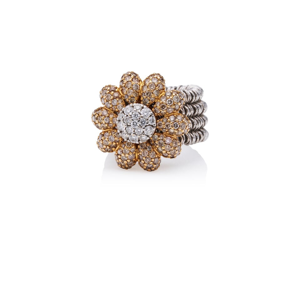 ROBERTO DEMEGLIO DIAMOND RING: ROBERTO DEMEGLIO DIAMOND RING - Diamond-set swivel flower - Flexible stretch shank - Stamped 750; Roberto Demeglio - Estimated gross weight approximately: 19.4gm - Ring size N Footnotes: Overall