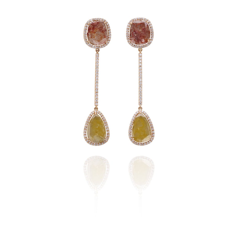 COLOURED DIAMOND SLICE AND BRILLIANT-CUT DIAMOND EARRINGS: COLOURED DIAMOND SLICE AND BRILLIANT-CUT DIAMOND EARRINGS Pinkish-brown and yellowish-brown diamond slices set within round brilliant diamond halos, joined by a diamond-set bar. Stamped: 750 Weight: 1