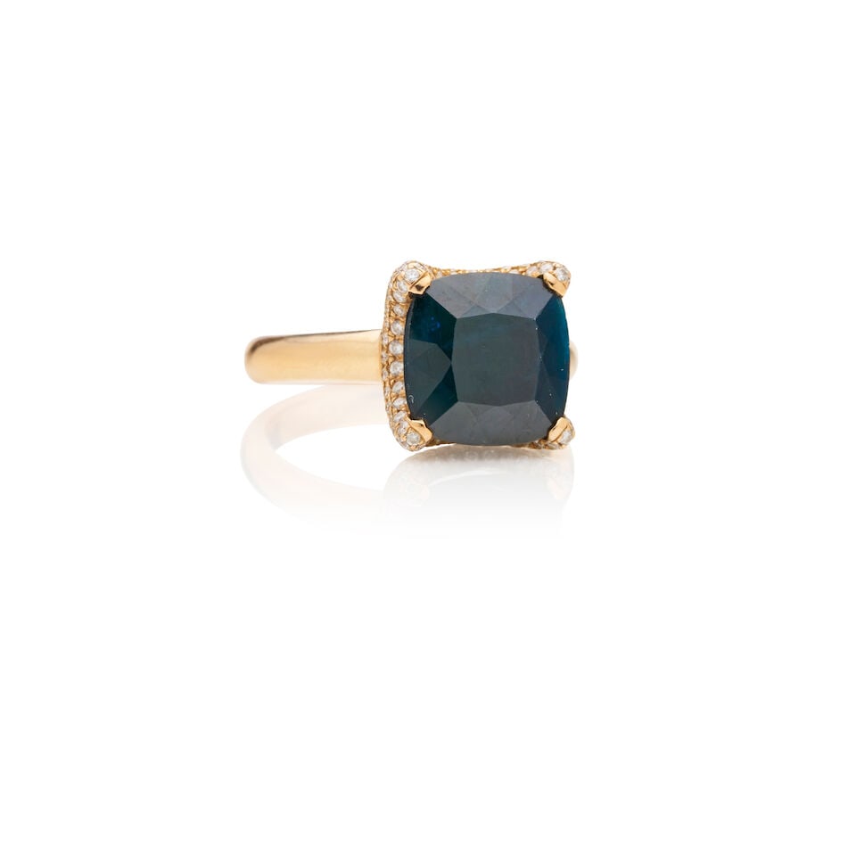 CERRONE | SAPPHIRE AND DIAMOND DRESS RING: CERRONE | SAPPHIRE AND DIAMOND DRESS RING Featuring a square cushion-cut deep blue sapphire, cantered within a pavé-set round brilliant cut diamond mount on a plain shank. Signed Cerrone. Weight 
