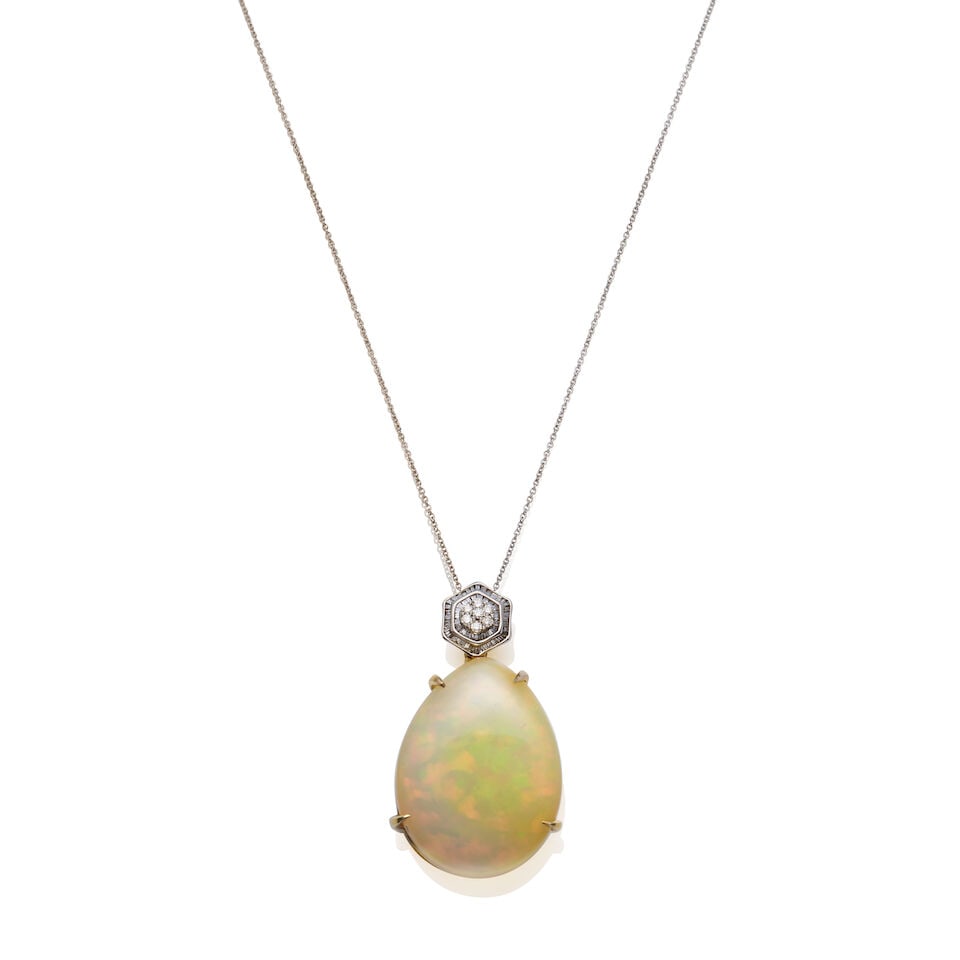 OPAL AND DIAMOND PENDANT NECKLACE: OPAL AND DIAMOND PENDANT NECKLACE • Pear shaped opal measuring approximately 29.8 X 22.4 X 11.0mm • Bail set with a cluster of round brilliant and baguette-cut diamonds • Stamped