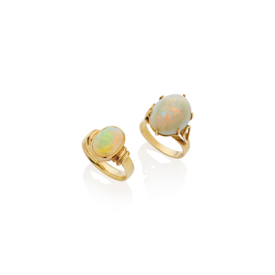 TWO OPAL RINGS: TWO OPAL RINGS 1. Opal cabochon measuring approximately 15.4 x 12.7 x 7.8mm, claw set in yellow gold, stamped 750, weight 5.9gm, ring size L. 2. Opal cabochon measuring approximately 12.5 x 8.6 x