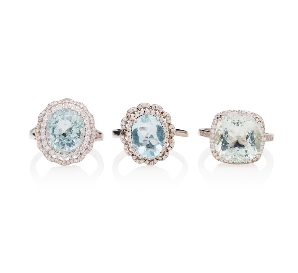 THREE SILVER AND AQUAMARINE RINGS: THREE SILVER AND AQUAMARINE RINGS 1. Aquamarine ring - Square cushion-cut measuring approximately 12.0mm - Round-cut white accent crystals - Stamped S925; estimated gross weight approximately: 3.7gm;