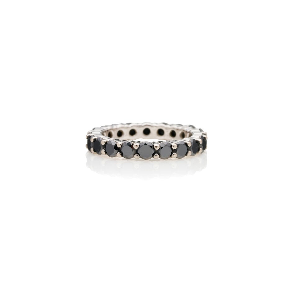 SAPPHIRE ETERNITY RING: SAPPHIRE ETERNITY RING - 18k white gold sapphire eternity ring - Dark blue round sapphires weighing approximately 2cts. - Weight 3.8gm - Ring size L Footnotes: OVERALL CONDITION: Metal unmarked. XRF