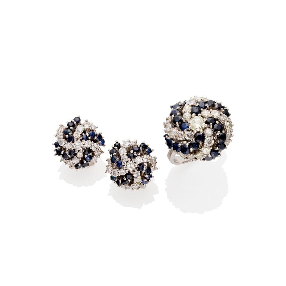SAPPHIRE AND DIAMOND EARRING AND RING SUITE: SAPPHIRE AND DIAMOND EARRING AND RING SUITE Bombé cluster of round brilliant cut diamonds and blue sapphires, claw set in 18k white gold, diamonds and sapphires each totalling approx. 3.0