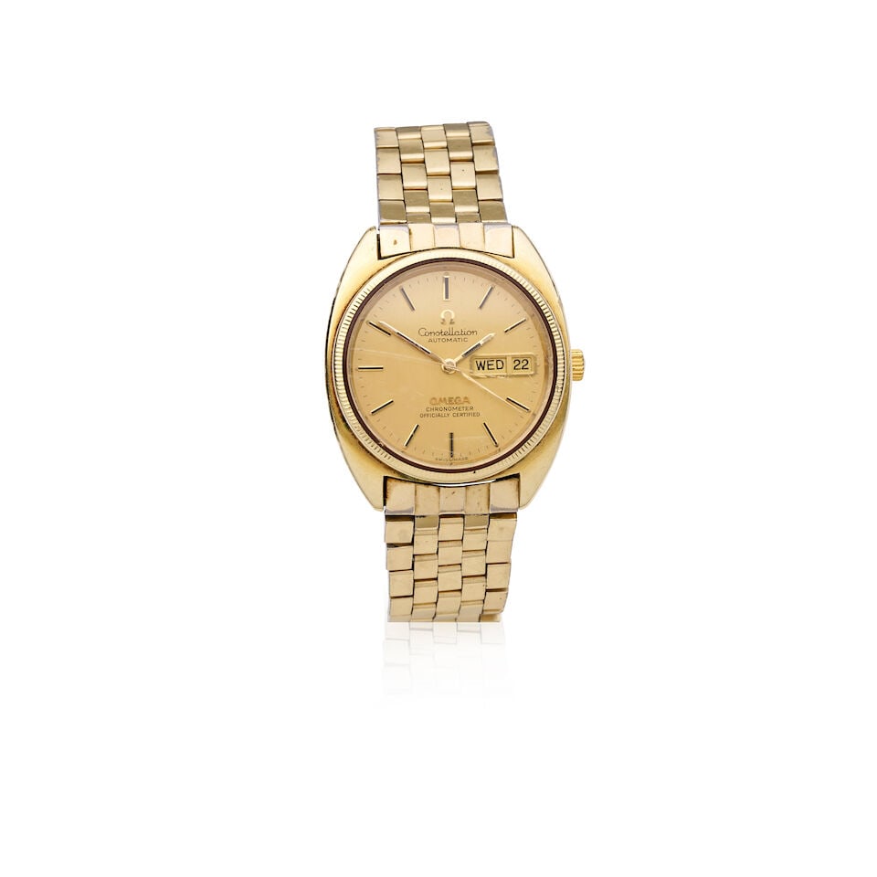 OMEGA | GOLD PLATED AUTOMATIC CALENDAR WRISTWATCH: OMEGA | GOLD PLATED AUTOMATIC CALENDAR WRISTWATCH Model: Constellation Reference: 168.029 Movement: Cal. 751, 24-jewel automatic Dial: Gilt Case: Tonneau form, screw down case back Strap/Bracelet: