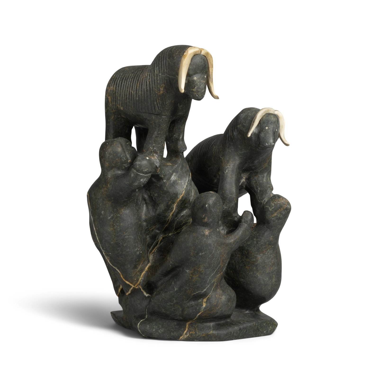A Tuna Iquliq stone sculpture, hunters and musk oxen: Tuna Iquliq Inuit, Qamanituaq (Baker Lake), (1935-2015), 'Hunters and Musk Oxen,' stone sculpture, signed in syllabics at the base. height 14 1/4in, width 9in Footnotes: Provenance The Estate of Mary 