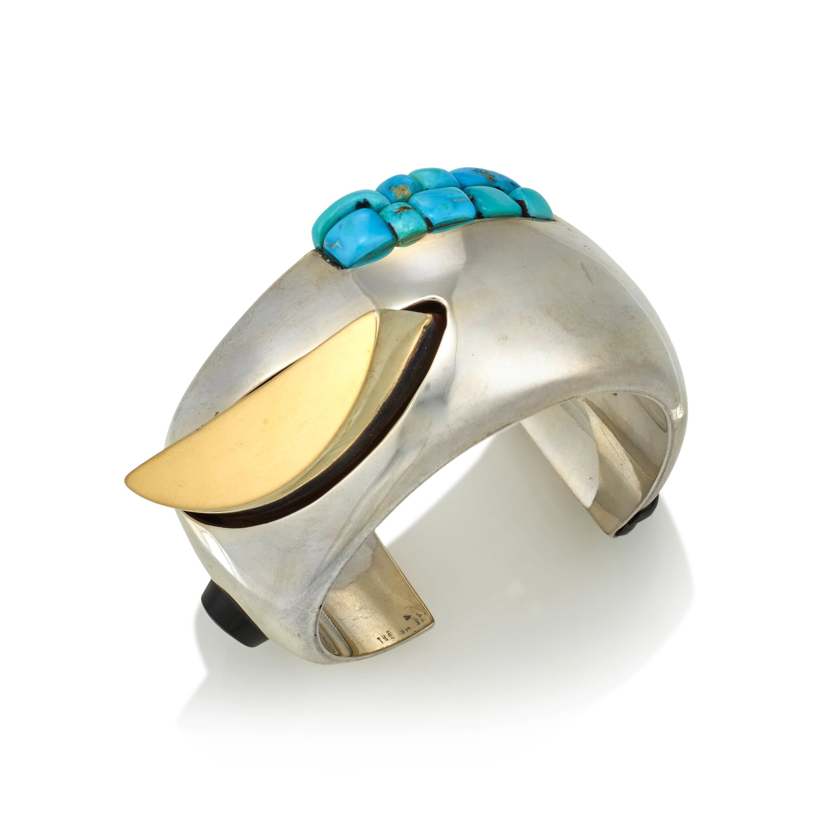 A Kim Rawdin silver and turquoise bracelet, 'The Drifting Moon': Kim Rawdin American, (b. 1950), 'The Drifting Moon,' hollow sterling silver cuff set with turquoise, onyx, and with a gold wash on the face of the demilune-shaped silver accent, stamped inscription on