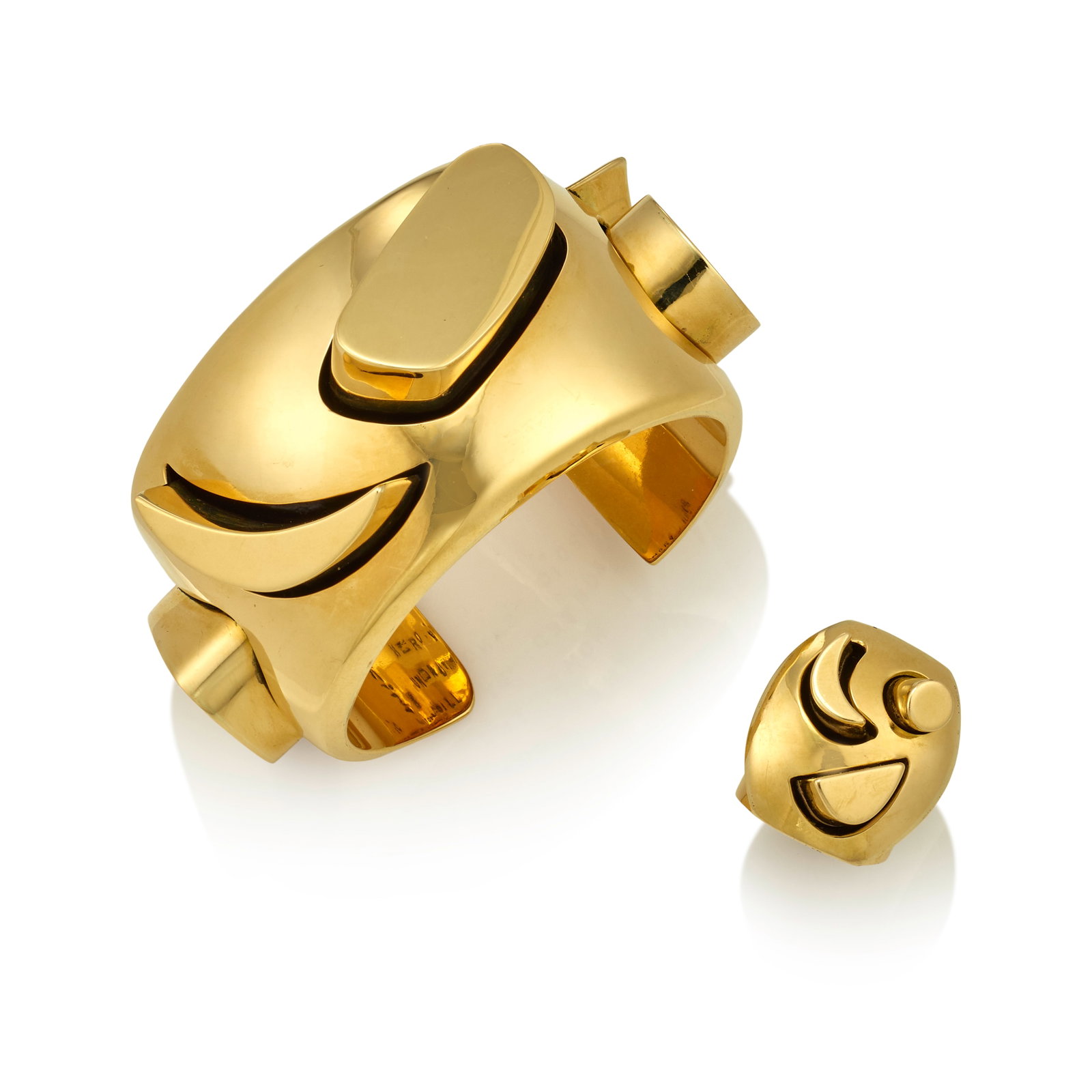 A Kim Rawdin 18k gold cuff bracelet and matching ring, 'Heroic Sandstone Cliffs,' 1996: Kim Rawdin American, (b. 1950), 'Heroic Sandstone Cliffs,' 1996, an 18k hollow gold cuff bracelet with geometric gold shapes, stamped inscription on the interior: Heroic Sandstone Cliffs / Undaunted b