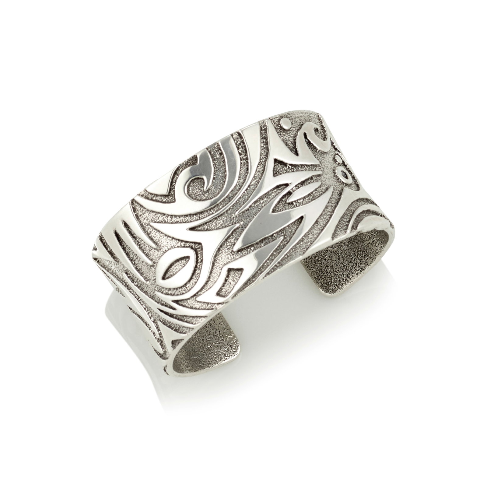 A Jared Chavez sterling silver bracelet: Jared Chavez San Felipe Pueblo/Diné (Navajo)/Hopi, (b. 1976), a sterling silver cast bracelet, worked in very fine abstract organic designs, signed with maker's mark on the interior. interior cir