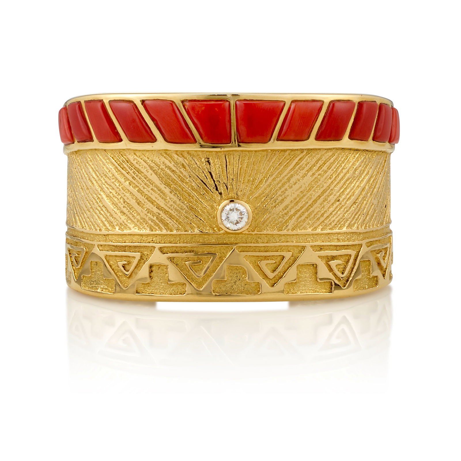 A Marian Denipah gold, coral and diamond cuff bracelet: Marian Denipah Diné (Navajo)/Tewa, (b. 1946), a heavy gold, coral and diamond cuff bracelet, designed with tapering terminals, the textured face inlaid with a row of trapezoid-cut coral stones ab