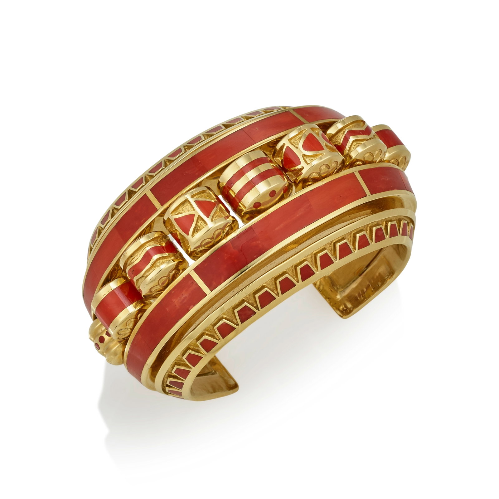 A Vernon Haskie 18K gold and coral cuff bracelet: Vernon Haskie Diné (Navajo), (b. 1968), a heavy 18K gold and red coral cuff bracelet with articulated barrel-shaped rollers with a variety of geometric inlaid motifs along the center space, stamp