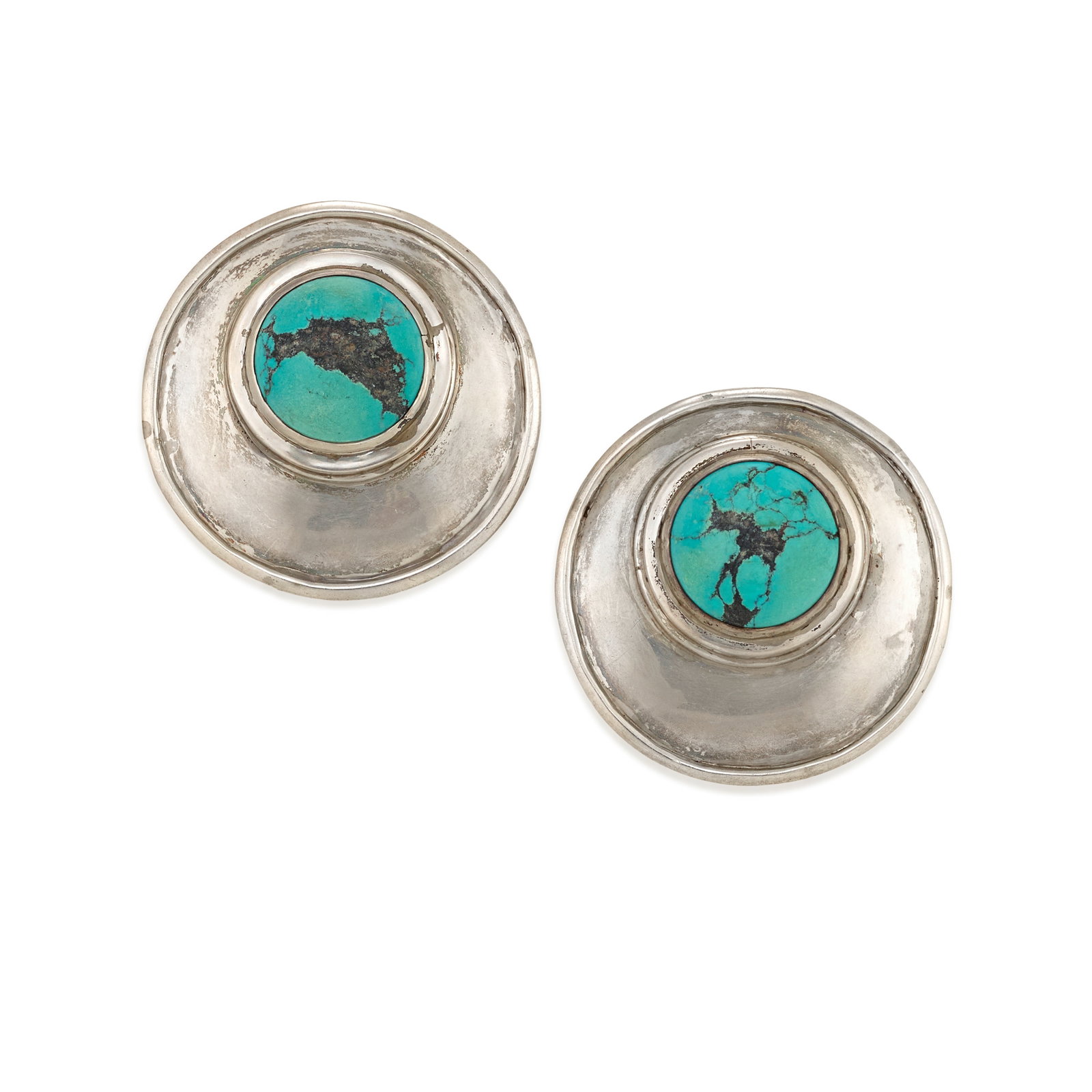 A pair of Eveli Sabatie (attributed) silver and turquoise earrings: Eveli Sabatie (attributed) Algerian/Moroccan, (b. 1940), a pair of silver and turquoise earrings, hammered finish verso, unsigned. diameter 1 5/8in; gross weight approximately 42.0g Footnotes: Silver 