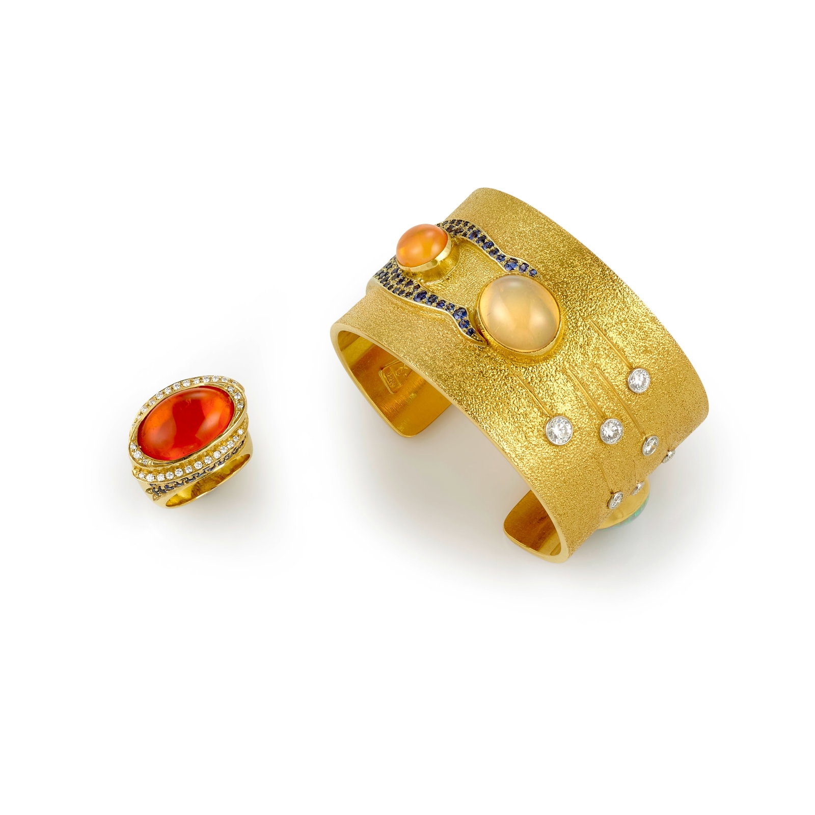 A Larry Vasquez gold cuff bracelet and ring set, 'Healing' and 'From Here to There': Larry Vasquez Mescalero Apache/Mayan/Aztec, (b. 1947), a bracelet and ring set, 2003, the 22k gold cuff titled 'From Here to There', set with opals, sapphires and diamonds (approximately 1.15 carats, 