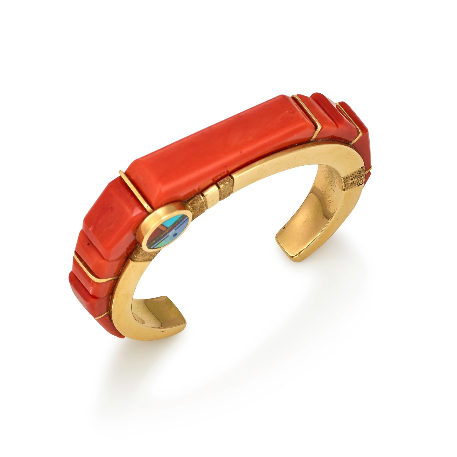 A Wes Willie 14k gold and multi-stone cuff bracelet: Wes Willie Diné (Navajo), (b. circa 1957), 2004, a 14k gold cuff bracelet with terraced landscape inlay, a mosaic katsina face on one side, set with coral, turquoise, lapis, opal and shell, signe