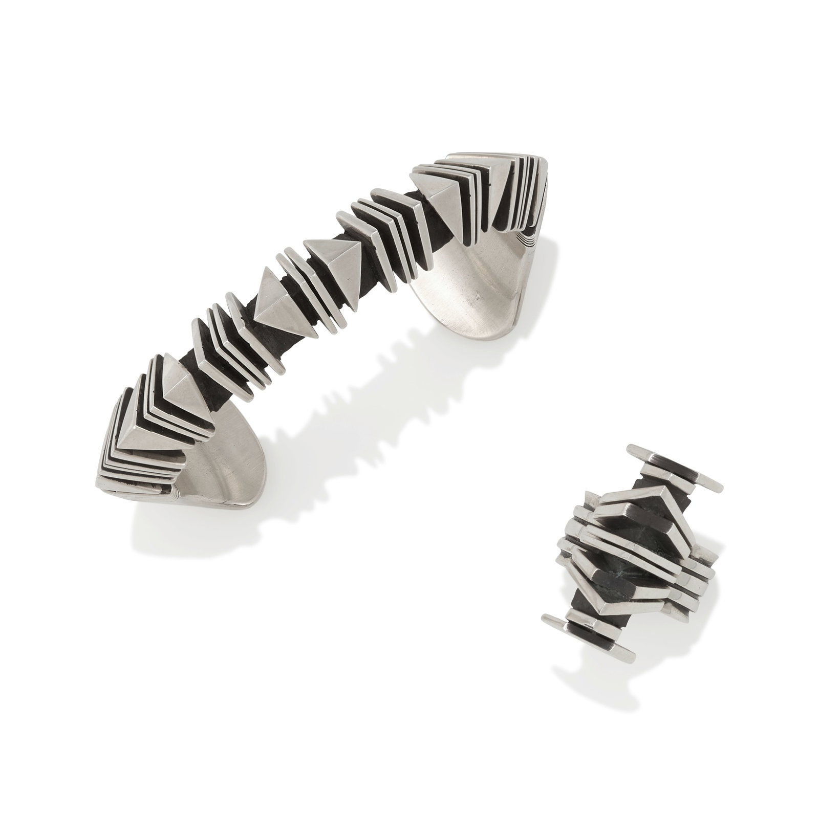 An Isaiah Ortiz sterling silver cuff bracelet and ring: Isaiah Ortiz San Felipe, (b. 1976), a sterling silver cuff bracelet and ring, each stamped: Isaiah / Sterling, the cuff further inscribed on the terminal: 6. ring: size approximately 5 1/2, length 1in