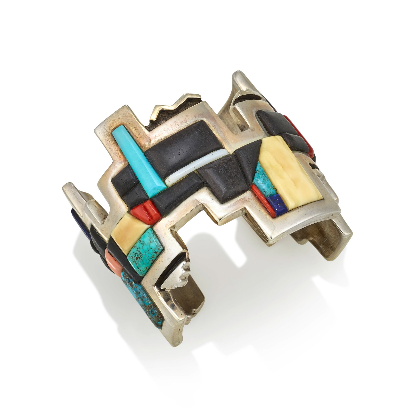 A Hanson 'Moogie' Smith sterling silver and multi-stone cuff bracelet: Hanson 'Moogie' Smith Diné (Navajo), (b. 1970), 'Lightning, Mountain, Clouds,' 2003, freeform geometric cuff bracelet, set with wood, turquoise, coral, sugilite, lapis and other materials, stampe