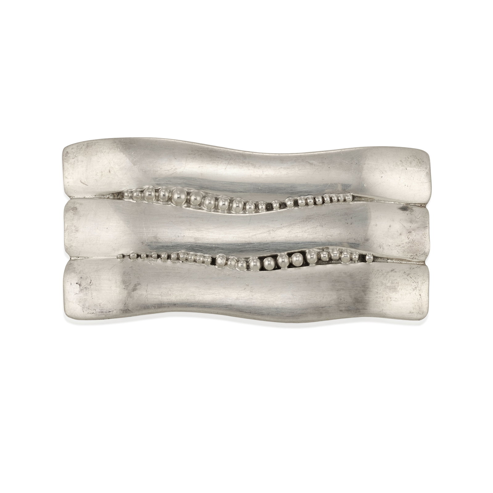 A Christina Alice Eustace silver belt buckle: Christina Alice Eustace Zuni/Cochiti Pueblo, (b. 1954), a sterling silver belt buckle with applied silver bead drop accents, signed: CAE / Sterling. length 2 7/8, width 1 1/4; gross weight approximate