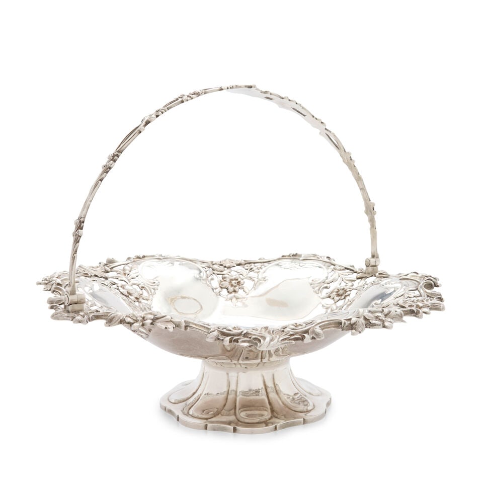 A Victorian Sterling Silver Cake Basket, Stephen Smith, London, 1869-70, retailed by Goldsmiths ...: A Victorian Sterling Silver Cake Basket, Stephen Smith, London, 1869-70, retailed by Goldsmiths Alliance Limited, Of shaped circular form with an undulating pierced floral and scrolled foliate rim, su