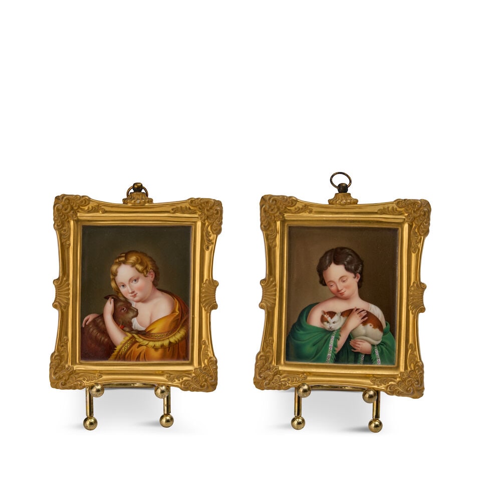 A Pair of Berlin Königliche Porzellan-Manufaktur Miniature Rectangular Portrait Plaques Ger...: A Pair of Berlin Königliche Porzellan-Manufaktur Miniature Rectangular Portrait Plaques German, circa 1835 Each painted with the portrait of a young girl, one tenderly holding a cat, the other a 