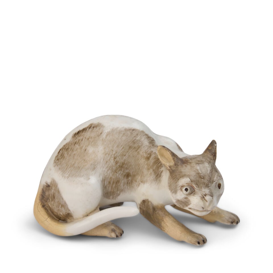 A Meissen Porcelain Model of a Crouching Cat circa 1750: A Meissen Porcelain Model of a Crouching Cat circa 1750 height 1 1/2 in. (3.81 cm.); width 2 7/8 in. (7.17 cm.); depth 1 1/2 in. (3.81 cm.) Footnotes: Provenance Christie's, Geneva, European Ceramics 