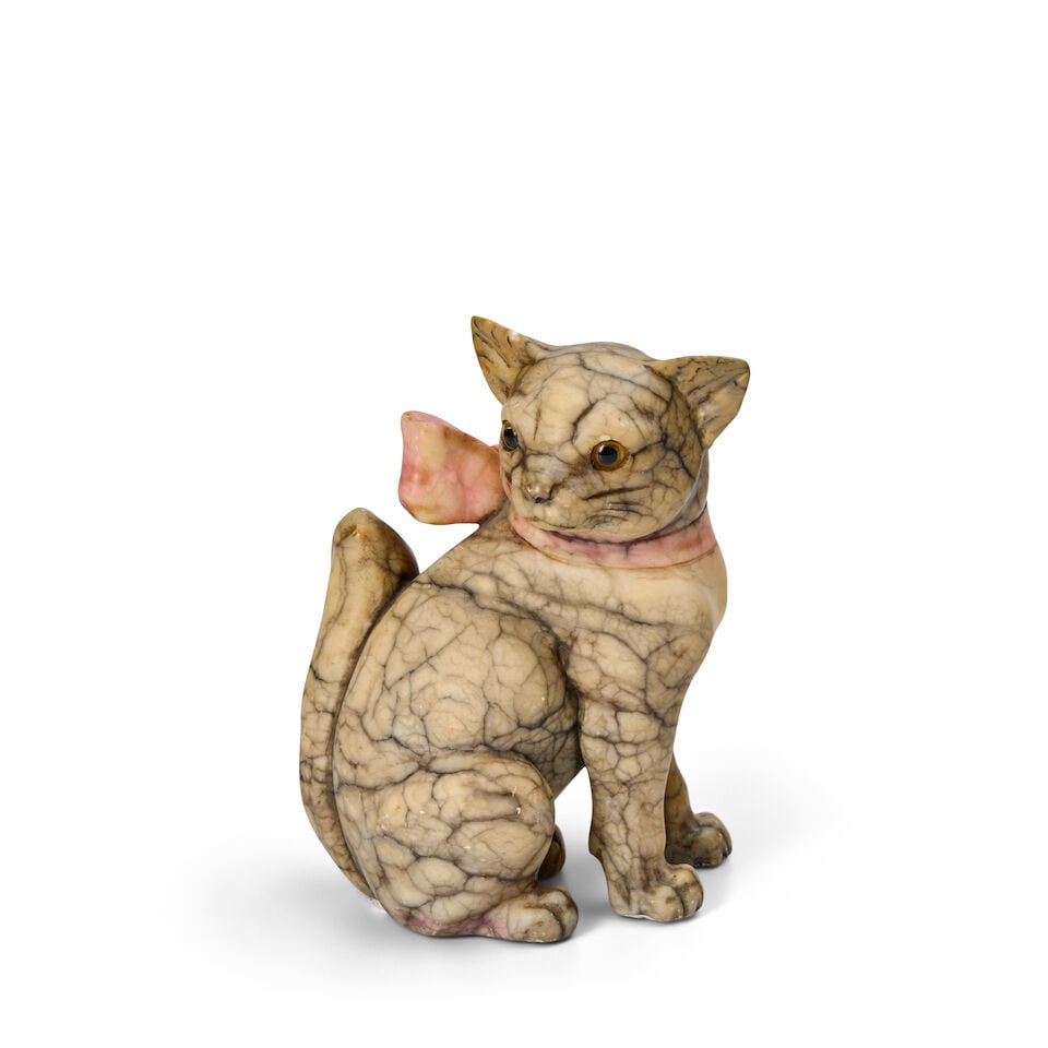 An English Carved Alabaster Model of a Seated Cat late 19th century: An English Carved Alabaster Model of a Seated Cat late 19th century with glass eyes height 8 5/8 in. (21.9 cm.); length 6 3/8 in. (16.19 cm.); width 4 3/4 in. (12.06 cm.) Footnotes: Provenance John Wa