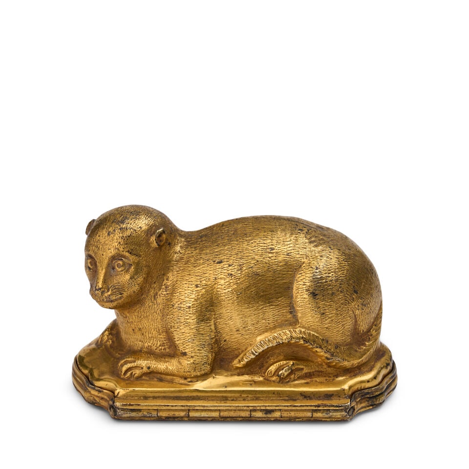A Silver Gilt Bonbonnière in the Form of a Cat: A Silver Gilt Bonbonnière in the Form of a Cat likely German, mid-18th century With small hallmark B to inner lip, and second hallmark worn; base engraved with a flower. height 2 in. (5.1 cm.); w