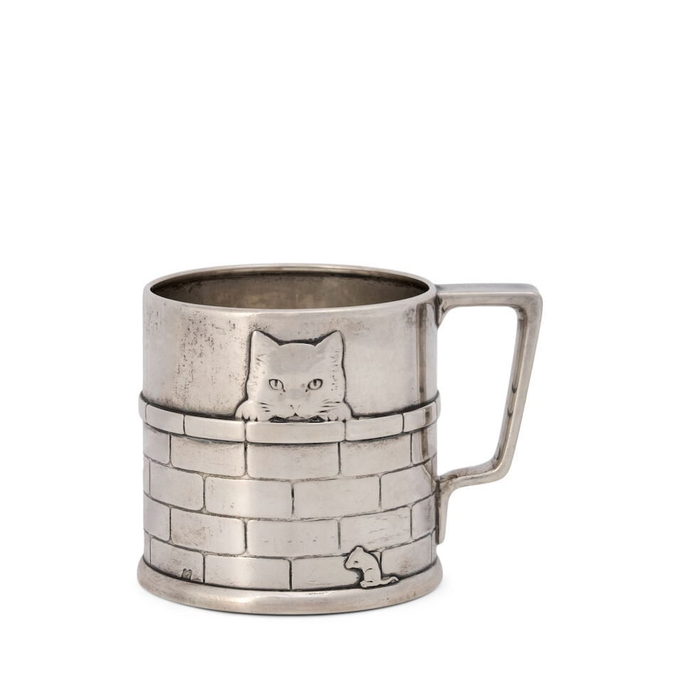 A Sterling Silver Child's Cup, Tiffany & Co. New York, 1907-38: A Sterling Silver Child's Cup, Tiffany & Co. New York, 1907-38 With English import marks for London, 1921, Albert William Feavearyear, importer, of cylindrical form, with two cats peaking over a brick