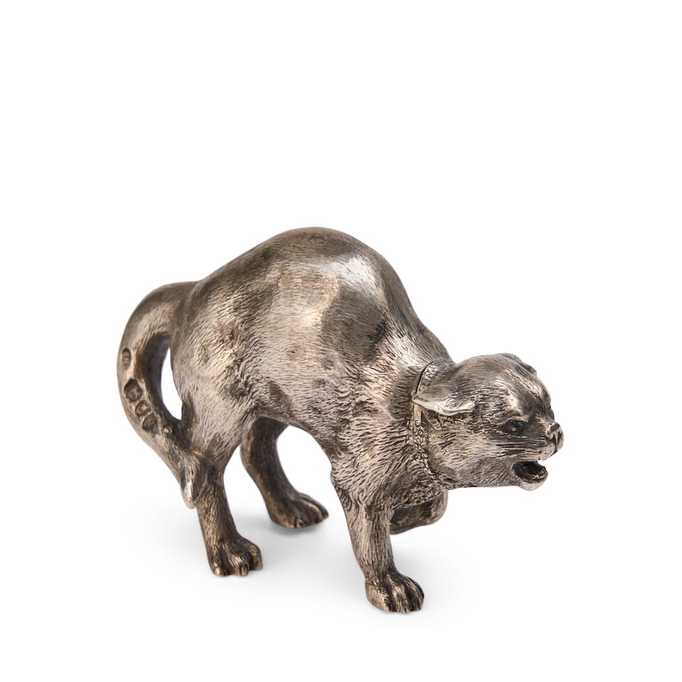 A Victorian Silver Pepperette in the Form of a Snarling Cat Edward H. Stockwell, London, 1891: A Victorian Silver Pepperette in the Form of a Snarling Cat Edward H. Stockwell, London, 1891 realistically modeled height 1 1/2 in. (3.81 cm.), width 2 1/4 in. (5.72 cm.), depth 1 in. (2.54 cm.) appr