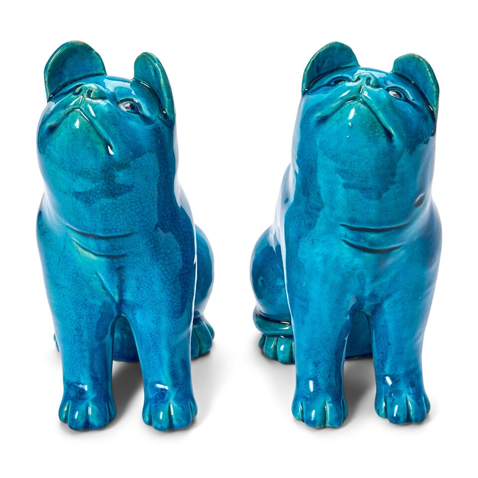 Two Turquoise Porcelain Models of Cats China, 20th century: Two Turquoise Porcelain Models of Cats China, 20th century Each seated on its back legs with straightened front legs, gazing intently upwards. height 9 3/8 in. (23.81 cm.); width 6 1/2 in. (16.51 cm.)