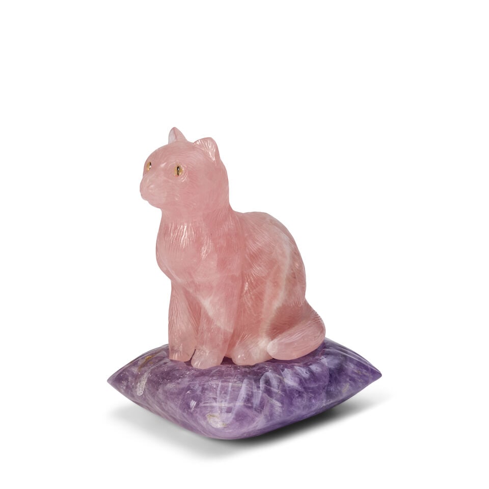 Peter Müller (Swiss, born 1952): A Rose Quartz Carving of a Cat 20th century: Peter Müller (Swiss, born 1952): A Rose Quartz Carving of a Cat 20th century unmarked on amethyst cushion cat height 3 3/4 in. (9.52 cm.); width 3 3/4 in. (9.52 cm.); depth 2 3/8 in. (6.03 cm.) p