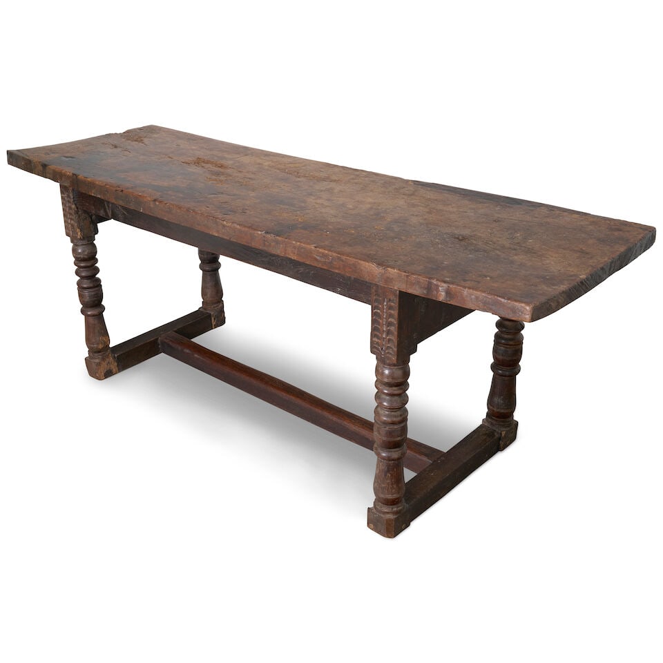 A Continental Provincial refectory table, 17th century and later,: A Continental Provincial refectory table, 17th century and later, with a single plank top, supported on turned legs with H stretchers, in mixed timbers of oak and walnut, with later modifications and