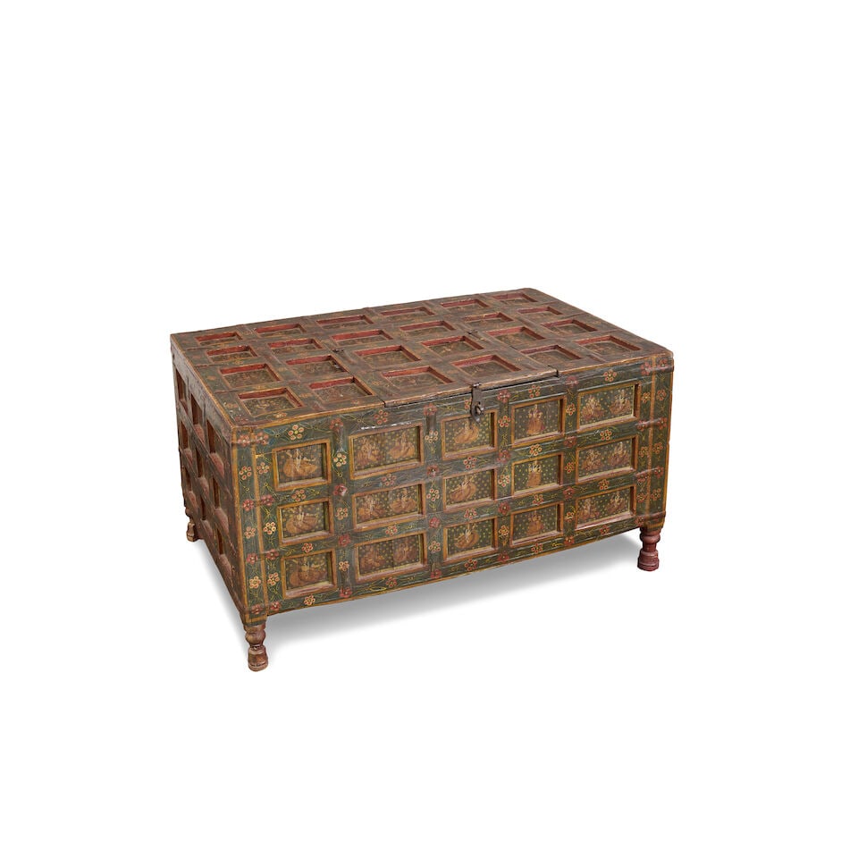 An early Indian coffered chest,: An early Indian coffered chest, each panel with polychrome decoration showing figures dancing, 56.5 x 101.00 x 67.5cm (including feet) For further information on this lot please visit Bonhams.com For